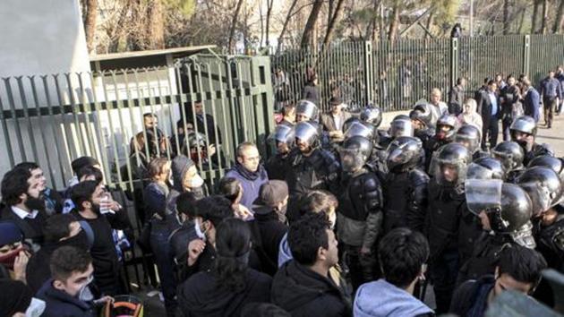 FILE- In this Dec. 30, 2017 file photo taken by an individual not employed by the Associated Press and obtained by the AP outside Iran, anti-riot Iranian police prevent university students to join other protesters over Iran weak economy, in Tehran, Iran.(AP)