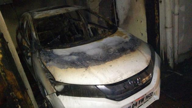 The fire started in the meter box room in the ground floor of Rajhans building and spread to the cars parked nearby. (Photo courtesy: Thane Municipal Corporation) The fire started in the meter box room in the ground floor of Rajhans building and spread to the cars parked nearby. (Photo courtesy: Thane Municipal Corporation)