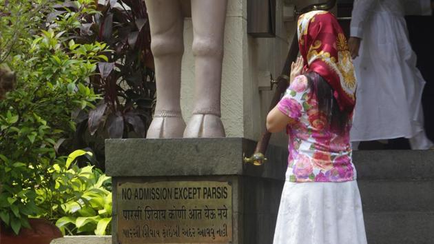A Parsi lady prays at an Agiary in Dadar, Mumbai. The Goolrokh Gupta vs Burjor Pardiwala case has given the Supreme Court a golden chance to reaffirm a very basic proposition: that religion cannot serve as a cloak to deny women equal status under the Constitution(Kalpak Pathak / Hindustan Times)