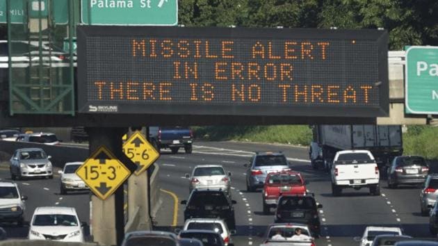 Cars drive past a highway sign that says "MISSILE ALERT ERROR THERE IS NO THREAT" on the H-1 Freeway in Honolulu. (AP Photo) Cars drive past a highway sign that says "MISSILE ALERT ERROR THERE IS NO THREAT" on the H-1 Freeway in Honolulu. (AP Photo)
