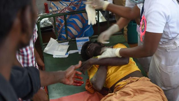 Medical staff treat an injured participant during the annual bull taming event. Tragedy struck Jallikattu celebrations nearby Palamedu on Monday, after a bull gored a spectator to death and injured 11 people. (Arun Sankar / AFP) Medical staff treat an injured participant during the annual bull taming event. Tragedy struck Jallikattu celebrations nearby Palamedu on Monday, after a bull gored a spectator to death and injured 11 people. (Arun Sankar / AFP)