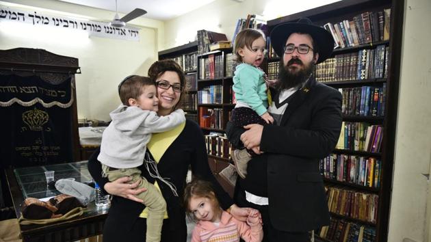 Rabbi Akiva Soundry (R), with his family at the Chabad House in Paharganj, Delhi. Sporting a black coat, trousers, white shirt, a hat and flowing black beard, Akiva Soundry may be an eccentric foreigner to many, but for the thousands of Israelis visiting Delhi, Akiva — the Rabbi at Chabad House in Paharganj —is a friend, a religious leader and a local guide. (Sanchit Khanna / HT Photo) Rabbi Akiva Soundry (R), with his family at the Chabad House in Paharganj, Delhi. Sporting a black coat, trousers, white shirt, a hat and flowing black beard, Akiva Soundry may be an eccentric foreigner to many, but for the thousands of Israelis visiting Delhi, Akiva — the Rabbi at Chabad House in Paharganj —is a friend, a religious leader and a local guide. (Sanchit Khanna / HT Photo)