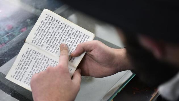 A Hasidic Jewish person reads from a Hebrew text. Chabad House is part of the Jewish community network headquartered in Brooklyn, New York. There are about 5,000 such centres, including 20 in India, advancing the orthodox Hasidic cause, a mystical Jewish movement founded in Poland in the 18th century in reaction to the rigid academicism of rabbinical Judaism. (Sanchit Khanna / HT Photo) A Hasidic Jewish person reads from a Hebrew text. Chabad House is part of the Jewish community network headquartered in Brooklyn, New York. There are about 5,000 such centres, including 20 in India, advancing the orthodox Hasidic cause, a mystical Jewish movement founded in Poland in the 18th century in reaction to the rigid academicism of rabbinical Judaism. (Sanchit Khanna / HT Photo)