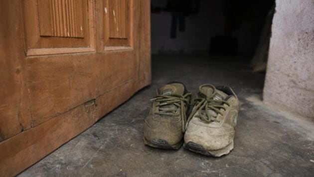 A pair of shoes belonging to Afrajul outside his house in Rajsamand. Even though his family has received Rs 8 lakh (Rs 5 lakh from the Rajasthan and Rs 3 lakh from the West Bengal governments respectively) as compensation, the murder of an exemplary family man and worker has frightened Muslims in the two states, reigniting debate over threats faced by the Muslim community, whether in their homes or while trading or travelling. (Burhaan Kinu / HT Photo) A pair of shoes belonging to Afrajul outside his house in Rajsamand. Even though his family has received Rs 8 lakh (Rs 5 lakh from the Rajasthan and Rs 3 lakh from the West Bengal governments respectively) as compensation, the murder of an exemplary family man and worker has frightened Muslims in the two states, reigniting debate over threats faced by the Muslim community, whether in their homes or while trading or travelling. (Burhaan Kinu / HT Photo)
