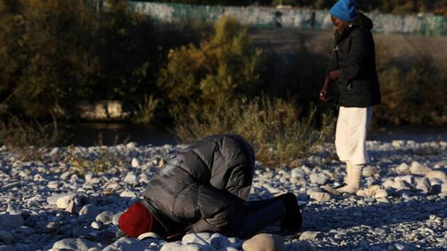 A man prays on a river bank after spending the night under a highway bypass from where migrants of mostly North African origin prepare to cross the Italian border into France, in the Mediterranean coastal town of Ventimiglia. (Siegfried Modola / Reuters) A man prays on a river bank after spending the night under a highway bypass from where migrants of mostly North African origin prepare to cross the Italian border into France, in the Mediterranean coastal town of Ventimiglia. (Siegfried Modola / Reuters)