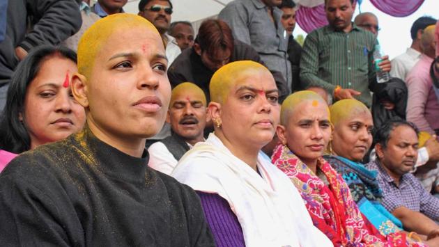 Female teachers, with their heads tonsured, take part in an 'Adhikar Rally' demanding the merger of their services with that of teachers on the roll in the state and payment as per the 7th pay commission, in Bhopal on Saturday. The protest today spread to other places in Madhya Pradesh such as Gwalior and Sagar. (PTI) Female teachers, with their heads tonsured, take part in an 'Adhikar Rally' demanding the merger of their services with that of teachers on the roll in the state and payment as per the 7th pay commission, in Bhopal on Saturday. The protest today spread to other places in Madhya Pradesh such as Gwalior and Sagar. (PTI)