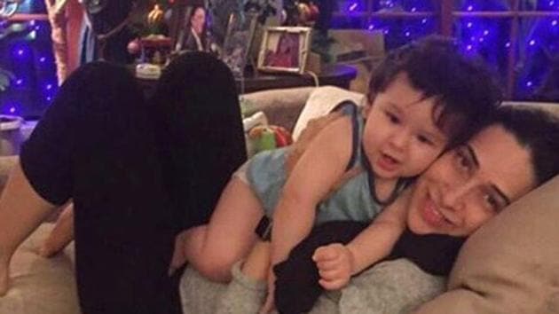 Taimur with his aunt Karisma on his first birthday.(Therealkarismakapoor/Instagram)