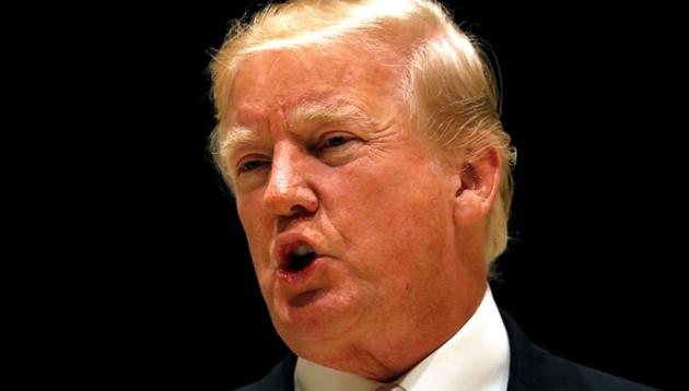 US President Donald Trump speaks upon arrival for dinner at his golf club in West Palm Beach. (Reuters Photo) US President Donald Trump speaks upon arrival for dinner at his golf club in West Palm Beach. (Reuters Photo)