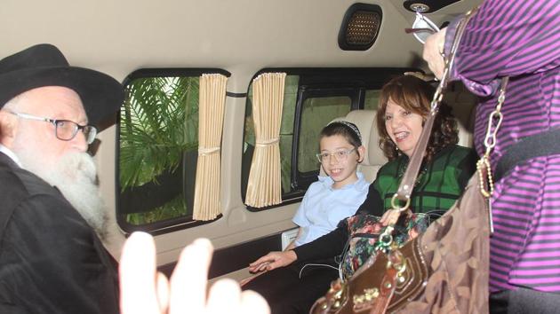 Israeli boy Moshe Holtzberg, whose parents Rabbi Gavriel and Rivka Holtzberg were killed by terrorists  at Nariman House, with his maternal and paternal grandparents on Tuesday. (Bhushan Koyande/HT) 