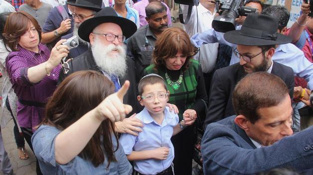 11-year-old Moshe Holtzberg , who lost his parents during the 2008 terror attacks, arrives with grandparents at Nariman House. (Bhushan Koyande/HT) 