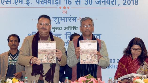 Chief minister Trivendra Singh Rawat releases a book at an event in Dehradun on Tuesday. (HT Photo) Chief minister Trivendra Singh Rawat releases a book at an event in Dehradun on Tuesday. (HT Photo)