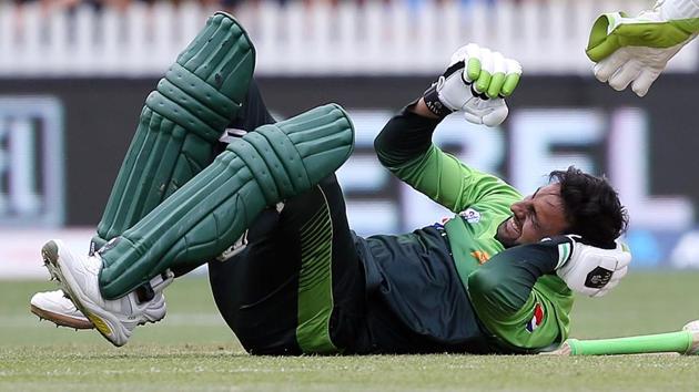 Pakistan's Shoaib Malik falls to the ground after being hit in the head during the fourth ODI against New Zealand on Tuesday. (AFP) Pakistan's Shoaib Malik falls to the ground after being hit in the head during the fourth ODI against New Zealand on Tuesday. (AFP)
