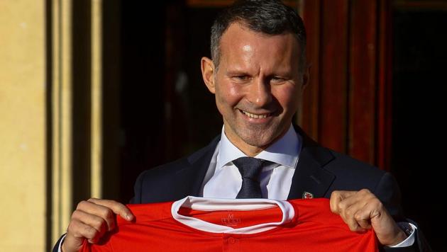 Newly appointed football manager of Wales, Ryan Giggs poses for photographers at the Hensol Castle hotel. (AFP) Newly appointed football manager of Wales, Ryan Giggs poses for photographers at the Hensol Castle hotel. (AFP)