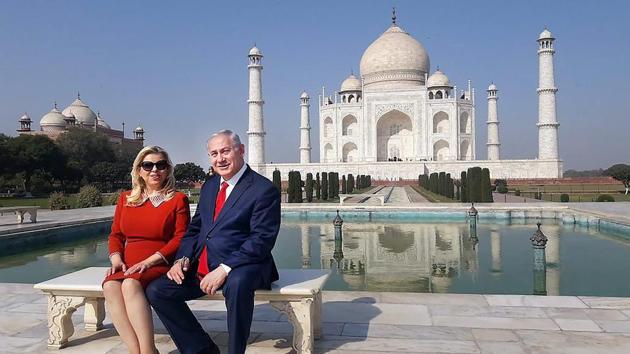Israeli PM Benjamin Netanyahu and wife Sara visit the Taj Mahal in Agra on Tuesday, a day after New Delhi and Tel Aviv signed nine pacts to boost bilateral ties in strategic areas. Ahead of Netanyahu’s visit, the local administration put the Taj under a security lockdown with Uttar Pradesh CM Yogi Adityanath receiving Netanyahu in Agra. (PTI) Israeli PM Benjamin Netanyahu and wife Sara visit the Taj Mahal in Agra on Tuesday, a day after New Delhi and Tel Aviv signed nine pacts to boost bilateral ties in strategic areas. Ahead of Netanyahu’s visit, the local administration put the Taj under a security lockdown with Uttar Pradesh CM Yogi Adityanath receiving Netanyahu in Agra. (PTI)