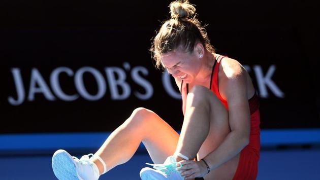 Romania's Simona Halep reacts after falling on the court during her match against Australia's Destanee Aiava. (REUTERS)