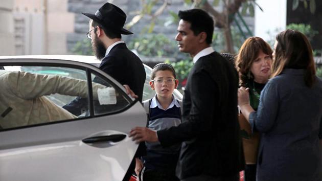 Moshe Holtzberg (C), who survived the 26/11 siege at Nariman House in Mumbai but lost his parents in it, arrived in the city on Tuesday morning for the first time since their death. Moshe said he would visit the Jewish centre in Colaba where his parents, Rabbi Gavriel and Rivka Holtzberg, were killed in the terror attacks in November 2008, and pray there. (PTI) Moshe Holtzberg (C), who survived the 26/11 siege at Nariman House in Mumbai but lost his parents in it, arrived in the city on Tuesday morning for the first time since their death. Moshe said he would visit the Jewish centre in Colaba where his parents, Rabbi Gavriel and Rivka Holtzberg, were killed in the terror attacks in November 2008, and pray there. (PTI)