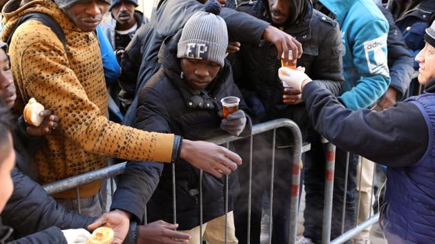 Aid volunteers from the Italian Catholic relief organisation Caritas give hot meals to migrants in Ventimiglia, Italy. In the past three months, around 1,500 and 2,000 migrants have tried to illegally cross the border into France, defying weather conditions and low temperatures. As Kamarra from Guinea sums his past, “After all that, crossing the Alps is not a big deal for me.” (Siegfried Modola / Reuters) Aid volunteers from the Italian Catholic relief organisation Caritas give hot meals to migrants in Ventimiglia, Italy. In the past three months, around 1,500 and 2,000 migrants have tried to illegally cross the border into France, defying weather conditions and low temperatures. As Kamarra from Guinea sums his past, “After all that, crossing the Alps is not a big deal for me.” (Siegfried Modola / Reuters)