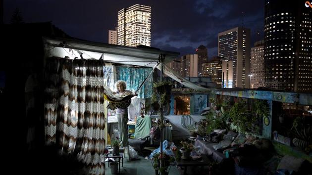 Ana Ashury, a mixed-media artist, stores away her artwork on her rooftop in Ramat Gan, a suburb of Tel Aviv. While she works as a video artist most of her time, Ana has recently started to use her rooftop work space as a workshop for collage creations. (Corinna Kern / REUTERS)