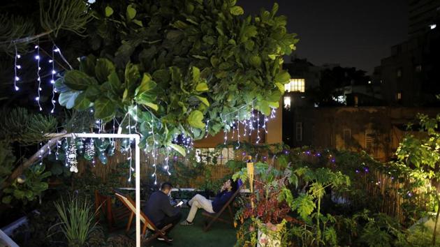 Ori Grossbard (R), 27, and Tomer Lulu, 27, spend their evening together on the rooftop adjacent to Ori's apartment in Tel Aviv. (Corinna Kern / REUTERS)