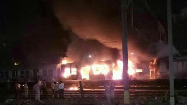 The fire broke out inside a coach of an empty train along platform number 1 of Thane station. (HT Photo) The fire broke out inside a coach of an empty train along platform number 1 of Thane station. (HT Photo)