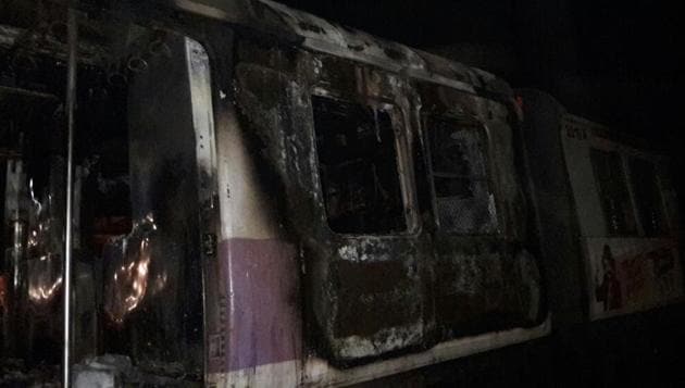 The empty coach caught fire around 1.45 am on Wednesdat near Thane station.(Praful Gangurde/HT Photo)