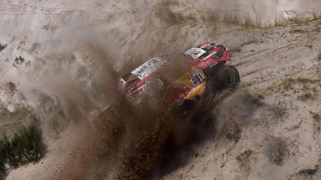 Toyota's Nasser Al-Attiyah of Qatar and his co-driver Matthieu Baumel of France negotiate a tricky climb during 10th stage of the Dakar Rally 2018 on Tuesday. (AFP)