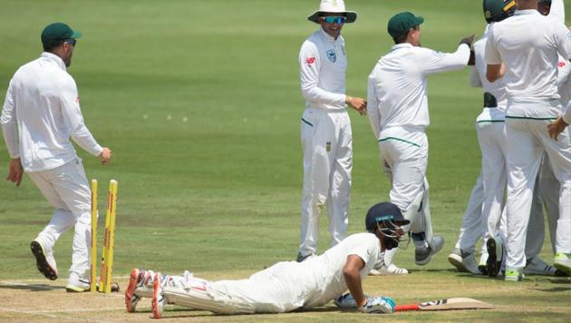 South African players celebrate after the run out of India’s Cheteshwar Pujara.(Reuters)