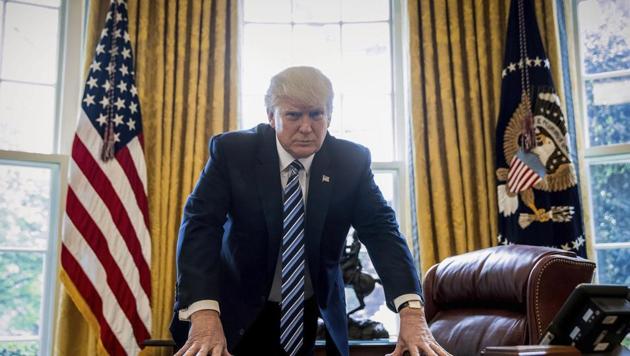 President Donald Trump poses for a portrait in the Oval Office in Washington.(AP File Photo)