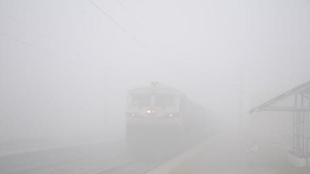 A train travels through the dense fog in Masuri, Ghaziabad, on Wednesday. (Sakib Ali /ht photo) A train travels through the dense fog in Masuri, Ghaziabad, on Wednesday. (Sakib Ali /ht photo)