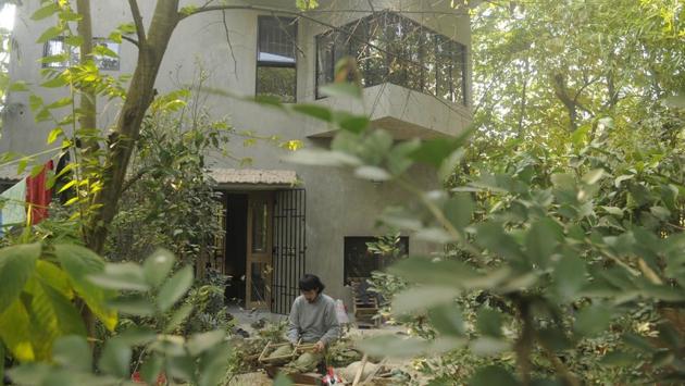 Nobuhiko Kawahara works in the lawns of the traditional Japanese house in Santiniketan. “Sato was impressed by mud architecture, samples of which are available in Santiniketan. It has prompted him to leave the exterior walls straight carrying a grey colour,” said Milon Dutta, an architect who did the structural design. (Samir Jana / HT Photo) Nobuhiko Kawahara works in the lawns of the traditional Japanese house in Santiniketan. “Sato was impressed by mud architecture, samples of which are available in Santiniketan. It has prompted him to leave the exterior walls straight carrying a grey colour,” said Milon Dutta, an architect who did the structural design. (Samir Jana / HT Photo)