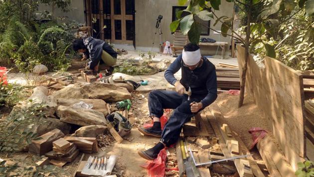 Kazuhiro Aoshima (R) with Nobuhiko Kawahara seen woodworking in the compound’s garden. After the interiors are finished, Bandyopadhyay plans to invite a gardener from Japan. A small memorial to Japanese Indologist and Tagore researcher Kazuo Azuma is also placed here. (Samir Jana / HT Photo) Kazuhiro Aoshima (R) with Nobuhiko Kawahara seen woodworking in the compound’s garden. After the interiors are finished, Bandyopadhyay plans to invite a gardener from Japan. A small memorial to Japanese Indologist and Tagore researcher Kazuo Azuma is also placed here. (Samir Jana / HT Photo)