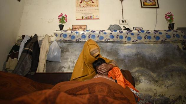 The mother and younger sister of the rape-murder victim at their village in Jhansa in Haryana.(Burhaan Kinu/HT Photo)