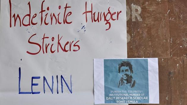 Posters on a wall in solidarity at the Jawaharlal Nehru University (JNU), as students went on an indefinite hunger strike. The controversy over Vemula’s caste status continues to simmer after the Justice Roopanwal Commission, which probed his death, and revenue officials of Guntur district, the student’s birthplace, held that he was not a Dalit. (Saumya Khandelwal / HT Photo) Posters on a wall in solidarity at the Jawaharlal Nehru University (JNU), as students went on an indefinite hunger strike. The controversy over Vemula’s caste status continues to simmer after the Justice Roopanwal Commission, which probed his death, and revenue officials of Guntur district, the student’s birthplace, held that he was not a Dalit. (Saumya Khandelwal / HT Photo)
