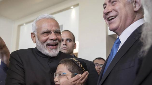 Prime Minister Narendra Modi and Israeli Prime Minister Benjamin Netanyahu with Moshe Holtzberg, an Israeli boy whose parents were killed in the November 26, 2008 terrorist attack on the Mumbai Chabad House (AP) Prime Minister Narendra Modi and Israeli Prime Minister Benjamin Netanyahu with Moshe Holtzberg, an Israeli boy whose parents were killed in the November 26, 2008 terrorist attack on the Mumbai Chabad House (AP)