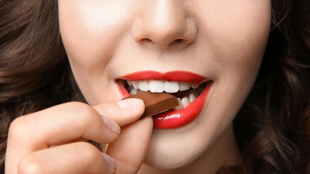 The little indulgence in the form of chocolate helps keep your mind off of stomach cramps and breakouts.(Shutterstock)