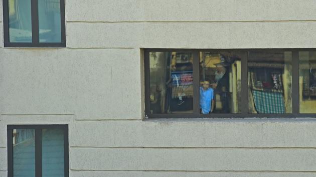 Moshe Holtzberg (C), son of slain US Rabbi Gavriel Holtzberg who was killed along with his wife in the November 26, 2008 attacks, looks out from Nariman (Chabad) house in Mumbai. (Vijayanand Gupta / HT Photo) Moshe Holtzberg (C), son of slain US Rabbi Gavriel Holtzberg who was killed along with his wife in the November 26, 2008 attacks, looks out from Nariman (Chabad) house in Mumbai. (Vijayanand Gupta / HT Photo)