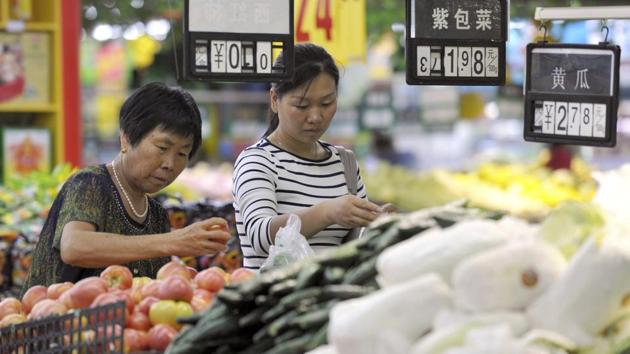 Women shop for produce at a supermarket in Fuyang in central China's Anhui province. (AP file) Women shop for produce at a supermarket in Fuyang in central China's Anhui province. (AP file)