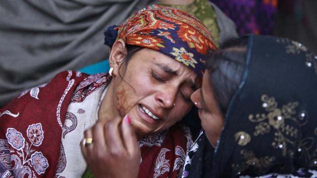 Mother of Neelam Devi, wails before her daughters funeral in Pindi in Arnia district of Jammu and Kashmir. Pakistani and Indian troops traded gunfire in the disputed region today, leaving three civilians and a soldier dead amid increasing tensions between the two nuclear-armed neighbours, officials from both sides said. (Channi Anand / AP) Mother of Neelam Devi, wails before her daughters funeral in Pindi in Arnia district of Jammu and Kashmir. Pakistani and Indian troops traded gunfire in the disputed region today, leaving three civilians and a soldier dead amid increasing tensions between the two nuclear-armed neighbours, officials from both sides said. (Channi Anand / AP)