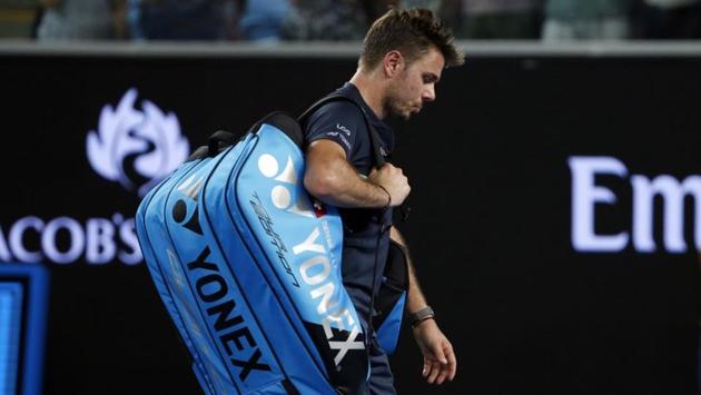 Switzerland's Stan Wawrinka walks off the court after losing to American tennis player Tennys Sandgren at the Margaret Court Arena. (REUTERS)