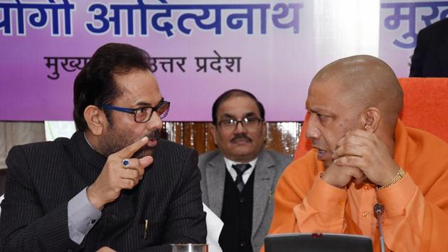 Uttar Pradesh Chief Minister Yogi Adityanath speaks with Union minister for minority affairs Mukhtar Abbas Naqvi during an event in Lucknow. Adityanath said on Thursday the education system in madrasas need to be modernised and that closing these minority institutions that offer studies in Islamic theology and religious laws is not a solution. (PTI) Uttar Pradesh Chief Minister Yogi Adityanath speaks with Union minister for minority affairs Mukhtar Abbas Naqvi during an event in Lucknow. Adityanath said on Thursday the education system in madrasas need to be modernised and that closing these minority institutions that offer studies in Islamic theology and religious laws is not a solution. (PTI)