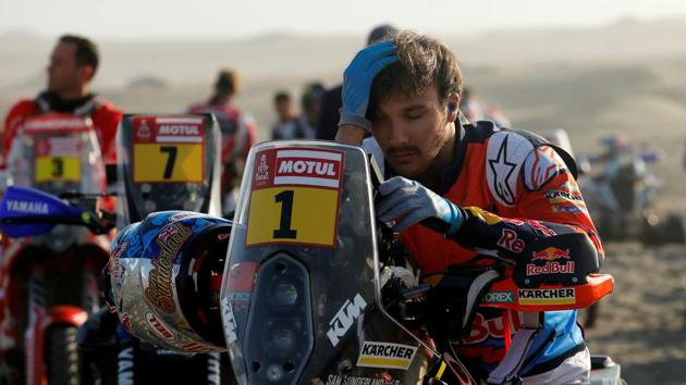 Sam Sunderland gets ready for Stage 4 next to his KTM. Sunderland quit the race after he suffered an accident and had to be evacuated later during the stage. (Andres Stapff / REUTERS) 