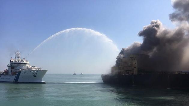 The Indian Coast Guard attempts to contain a major fire on the MT Genessa oil tanker near Kandla Port in Gujarat. The Indian Coast Guard said on January 18, 2018 it had evacuated 26 crew members of the oil tanker after a fire broke out, and that a water sample test showed no sign of spillage from the vessel’s cargo of 30,000 tons of diesel fuel. (Gujarat Defence Ministry / AFP) The Indian Coast Guard attempts to contain a major fire on the MT Genessa oil tanker near Kandla Port in Gujarat. The Indian Coast Guard said on January 18, 2018 it had evacuated 26 crew members of the oil tanker after a fire broke out, and that a water sample test showed no sign of spillage from the vessel’s cargo of 30,000 tons of diesel fuel. (Gujarat Defence Ministry / AFP)