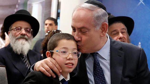 Israeli Prime Minister Benjamin Netanyahu (R) kisses Moshe Holtzberg, who survived during the 26/ 11 attacks, at Chabad House in Mumbai on January 18, 2018. (Danish Siddiqui / REUTERS) Israeli Prime Minister Benjamin Netanyahu (R) kisses Moshe Holtzberg, who survived during the 26/ 11 attacks, at Chabad House in Mumbai on January 18, 2018. (Danish Siddiqui / REUTERS)
