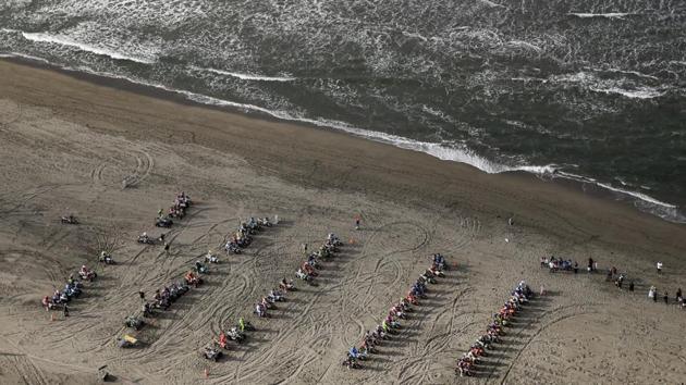 Competitors line up on motorcycles and quadbikes for the Stage 4 of the rally along the beach in San Juan de Marcona, Peru. 54 nationalities were represented this year with two Indian contingents from Hero and Sherco TVS. (Ricardo Mazalan / AP) 