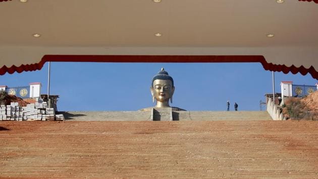The Buddha Dordenma statue stands in Thimphu. Signs of change are everywhere, pulling the country of snow-capped, jagged mountains, forests, rivers and clean air into the modern world. Smoke billows from construction sites across the country and this giant bronze-and-gold Buddha statue that commands the entry to Thimphu valley now shares space with telecom towers. (Cathal McNaughton / REUTERS) The Buddha Dordenma statue stands in Thimphu. Signs of change are everywhere, pulling the country of snow-capped, jagged mountains, forests, rivers and clean air into the modern world. Smoke billows from construction sites across the country and this giant bronze-and-gold Buddha statue that commands the entry to Thimphu valley now shares space with telecom towers. (Cathal McNaughton / REUTERS)