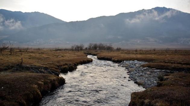 A stream runs through the Phobjikha Valley in Bhutan. A territory that was never colonized in its history and led by Buddhist theocracy, Bhutan has largely remained aloof from modernization. Today, bars dot the capital, set in mist-covered mountains while teenagers crowd internet cafes to play video games, and men smoke and gamble in snooker halls. (Cathal McNaughton / REUTERS) A stream runs through the Phobjikha Valley in Bhutan. A territory that was never colonized in its history and led by Buddhist theocracy, Bhutan has largely remained aloof from modernization. Today, bars dot the capital, set in mist-covered mountains while teenagers crowd internet cafes to play video games, and men smoke and gamble in snooker halls. (Cathal McNaughton / REUTERS)