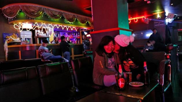 Women share a joke in a Karaoke bar in Thimphu. Bhutan continues to grow rapidly, bringing opportunities and a new future for its younger generation but treads a fine line between maintaining its past and a reaching out to development. (Cathal McNaughton / REUTERS) Women share a joke in a Karaoke bar in Thimphu. Bhutan continues to grow rapidly, bringing opportunities and a new future for its younger generation but treads a fine line between maintaining its past and a reaching out to development. (Cathal McNaughton / REUTERS)