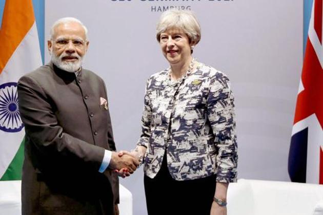 Prime Minister Narendra Modi with Britain's Prime Minister Theresa May on the sidelines of the G-20 Summit in Hamburg.(PTI File)