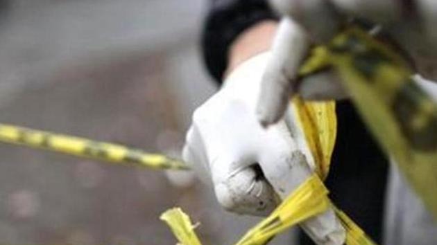 A forensic technician ties a used police line together to seal off a crime scene in Monterrey. Reuters Photo/Daniel Becerril (Reuters File Photo) A forensic technician ties a used police line together to seal off a crime scene in Monterrey. Reuters Photo/Daniel Becerril (Reuters File Photo)