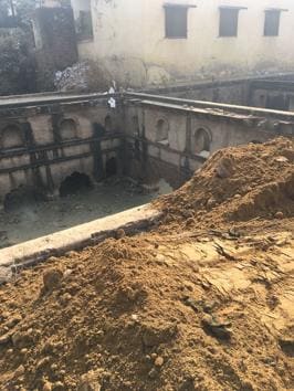 The present owner of the land claimed that the stepwell is being filled up to build a sector road.(HT PHOTO)